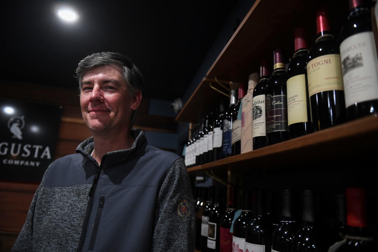 Owner of Augusta Wine Company Jason Jones poses for a portrait inside the store on Wednesday, Jan. 3, 2024.