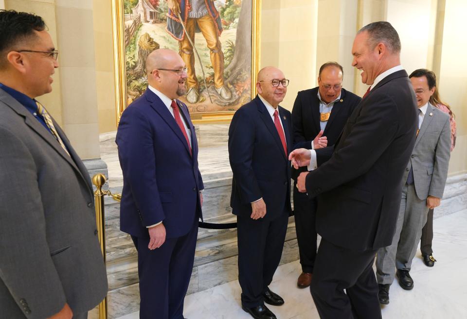 House Speaker Charles McCall laughs as he talks with Muscogee Nation Second Chief Del Beaver, left, Chickasaw Lt. Gov. Chris Anoatubby, Chickasaw Gov. Bill Anotubby, Choctaw Chief Gary Batton and Cherokee Principal Chief Chuck Hoskin Jr. Tuesday after they appeared during a two-day study on state-tribal compacts at the Oklahoma Capitol.