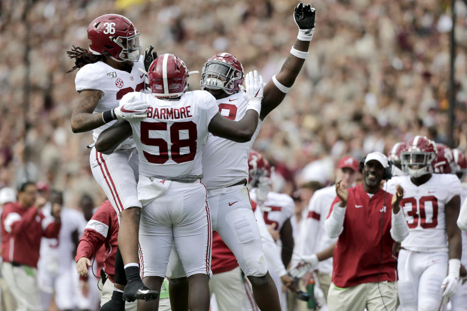 Alabama defensive lineman Christian Barmore (58) celebrates with teammates after sacking Texas A&M quarterback Kellen Mond (11) during the first half of an NCAA college football game, Saturday, Oct. 12, 2019, in College Station, Texas. (AP Photo/Sam Craft)