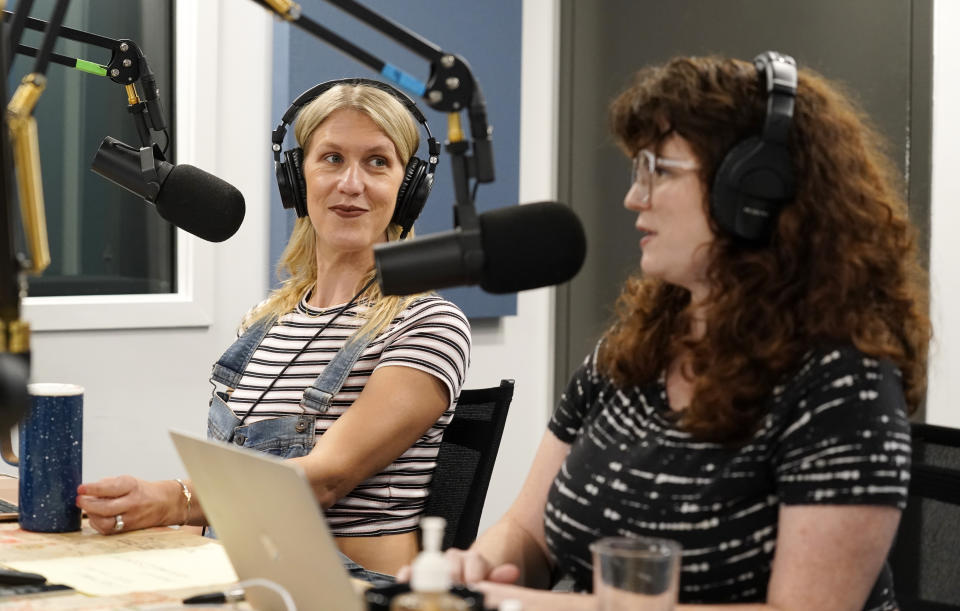 Tess Barker, left, and Barbara Gray, co-hosts of the "Britney's Gram" podcast, talk in the studio at Earwolf podcast studio, Thursday, July 15, 2021, in Los Angeles. (AP Photo/Chris Pizzello)