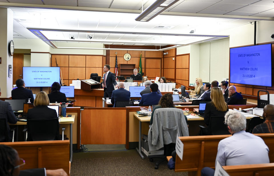 Defense attorney Casey Arbenz, center left, gives opening statements on behalf of defendant Matthew Collins during the trial of three Tacoma Police officers in the killing of Manny Ellis at Pierce County Superior Court, Monday, Nov. 13, 2023, in Tacoma, Wash. Tacoma Police Officers Christopher Burbank, Matthew Collins and Timothy Rankine stand trial for charges related to the March 2020 killing of Manny Ellis. (Brian Hayes/The News Tribune via AP, Pool)