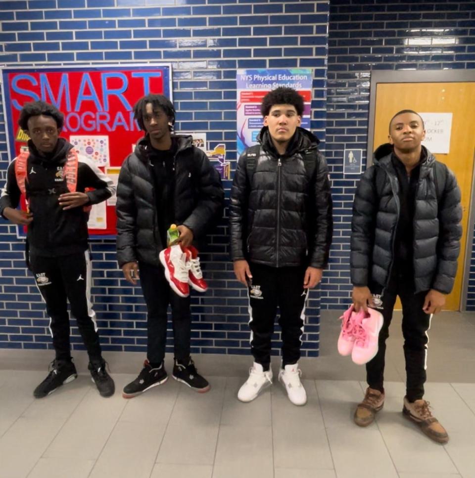 East High basketball players from left to right: Micah Johnson-Breedlove, Zion Parson, Markell Johnson, Keysean Leonard after a 61-47 win at Monroe on Tuesday, Jan. 30.