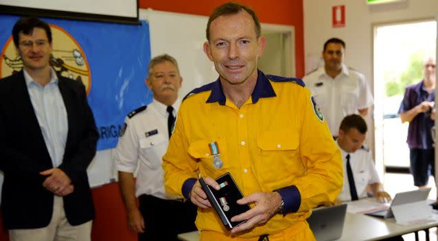 In 2015, Mr Abbott was awarded a 10-year service medal for his volunteer work with the NSW Rural Fire Service. Photo: Twitter