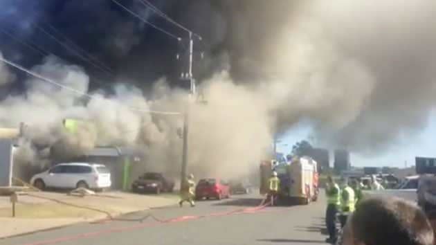 Amateur pictures of smoke billowing from the smash reparis business at Bulimba