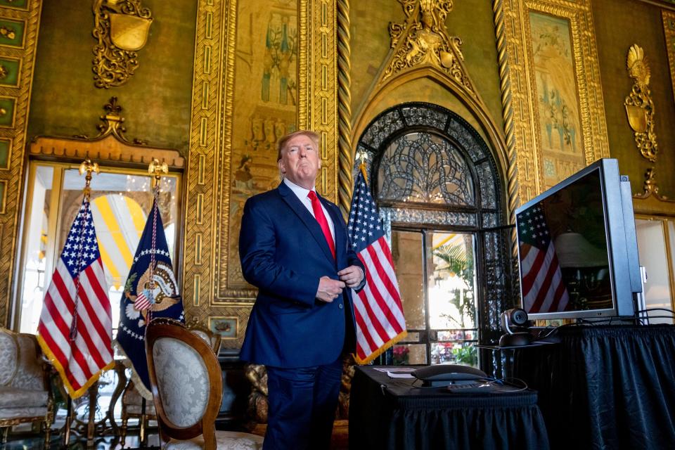 President Donald Trump speaks to the media after making a Christmas Eve video conference call to members of the armed forces from Mar-a-Lago on December 24, 2019.