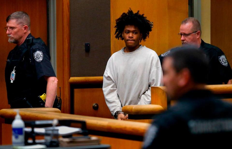 Murder suspect Vontell Wesson Jr. is escorted into the courtroom by corrections officers for his preliminary appearance in March 2023 in Benton County Superior Court in Kennewick.