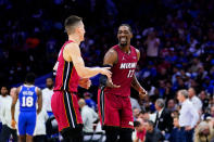 Miami Heat's Tyler Herro, left, and Miami Heat's Bam Adebayo celebrate during the second half of Game 6 of an NBA basketball second-round playoff series against the Philadelphia 76ers, Thursday, May 12, 2022, in Philadelphia. (AP Photo/Matt Slocum)