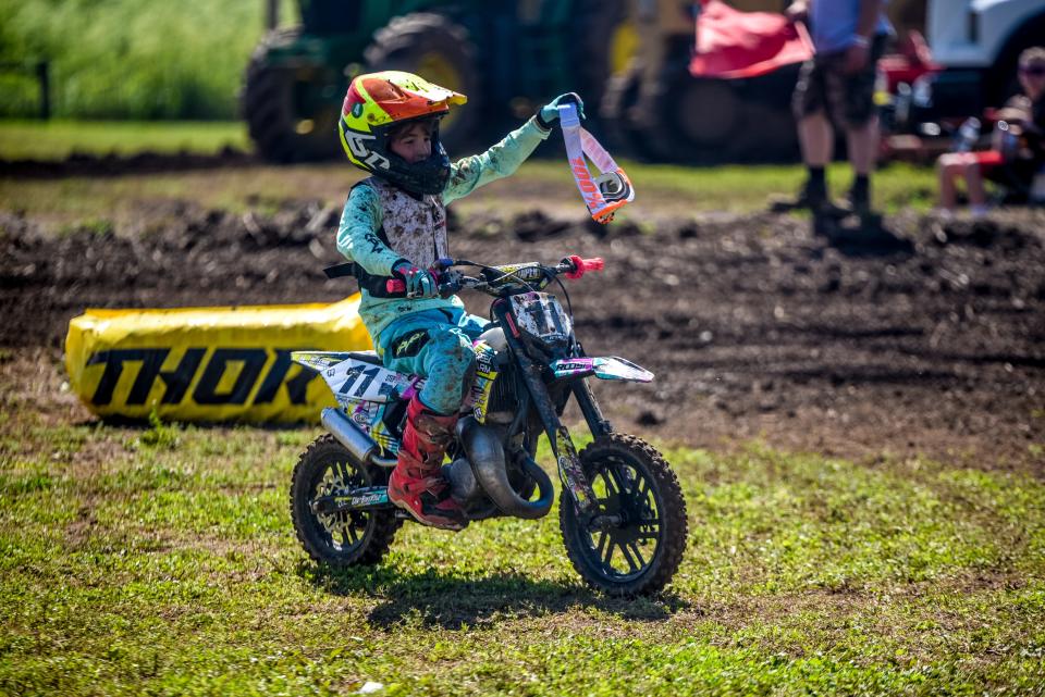 Drake Boatman celebrates after finishing a race at the AMA Motocross Mid-East Youth Regional Championship in Chillicothe, Ohio, on Saturday, June 12, 2022.