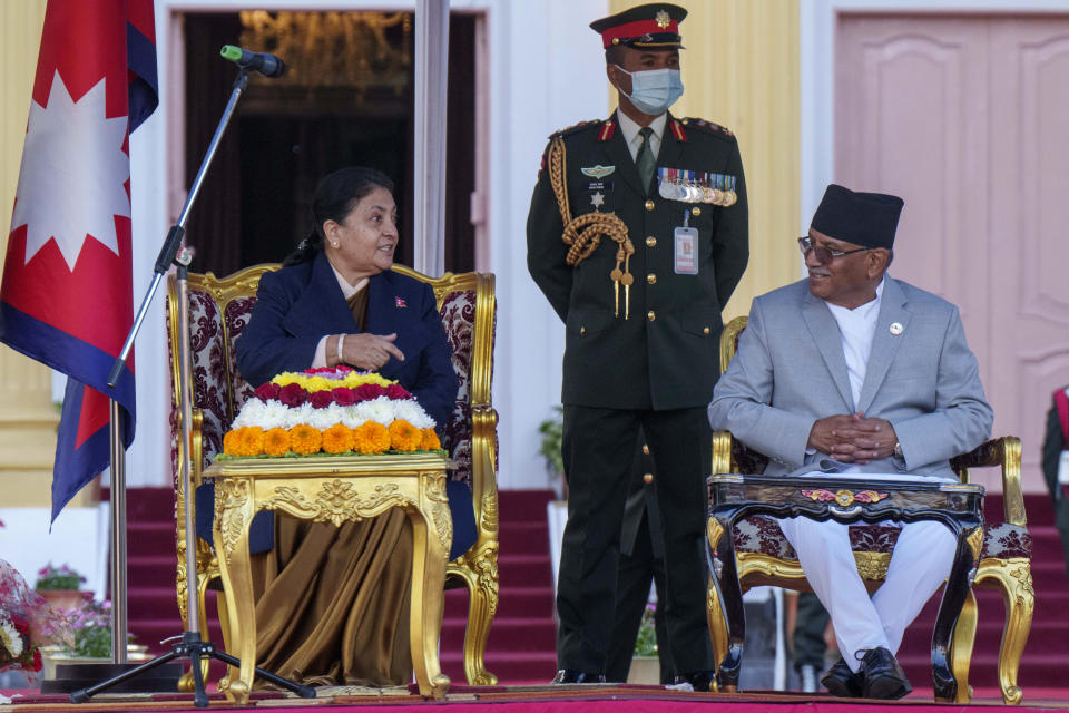 Nepal’s newly appointed prime minister Pushpa Kamal Dahal, right, interacts with President Bidhya Devi Bhandari, left, after he was sworn in during a ceremony at the President House in in Kathmandu, Nepal, Monday, Dec. 26, 2022. Dahal has appointed three deputies and four other ministers in the Cabinet that is expected to be expanded in the next few days to accommodate more members from the seven parties in the new coalition government. (AP Photo/Niranjan Shrestha)