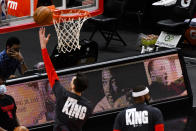 Houston Rockets players warm-up wearing shirts that honors Dr. Martin Luther King Jr., before an NBA basketball game against the Chicago Bulls, Monday, Jan. 18, 2021, in Chicago. (AP Photo/Matt Marton)