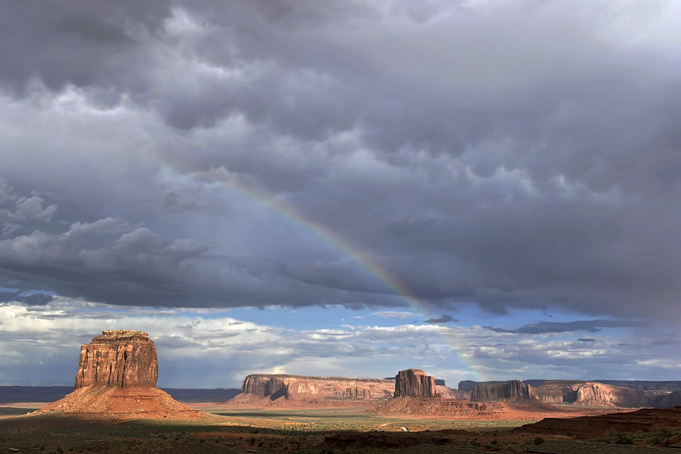 Clouds dissipate after a rainstorm during the monsoon season Friday, June 28, 2024, in Monument Valley, Ariz. Thunderstorms are hopscotching around the Southwestern U.S., bringing much-needed moisture to a region where every drop counts. (AP Photo/Susan Montoya Bryan)