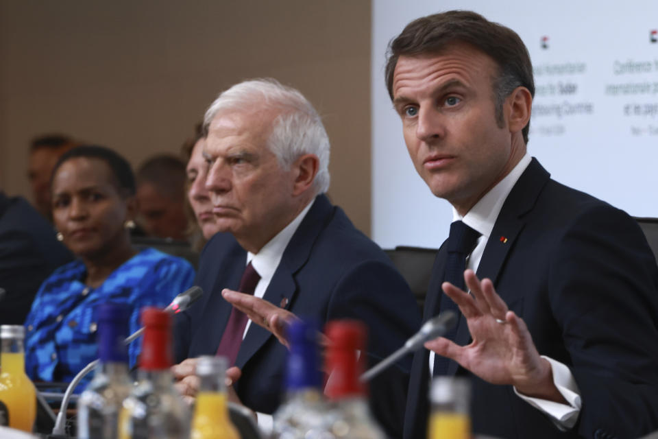 French President Emmanuel Macron, right, speaks during a session at the international conference on Sudan, Monday, April 15, 2024 in Paris. Top diplomats and aid groups met in the French capital to drum up humanitarian support for Sudan after a yearlong war has devastated the northeastern African country and pushed its people to the brink of famine. (AP Photo/Aurelien Morissard; Pool)