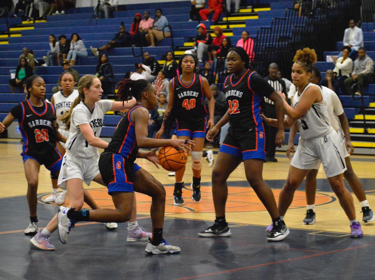 Palm Beach Garden's Alicia Russell drives to the rim against Dwyer on Feb. 1, 2024.