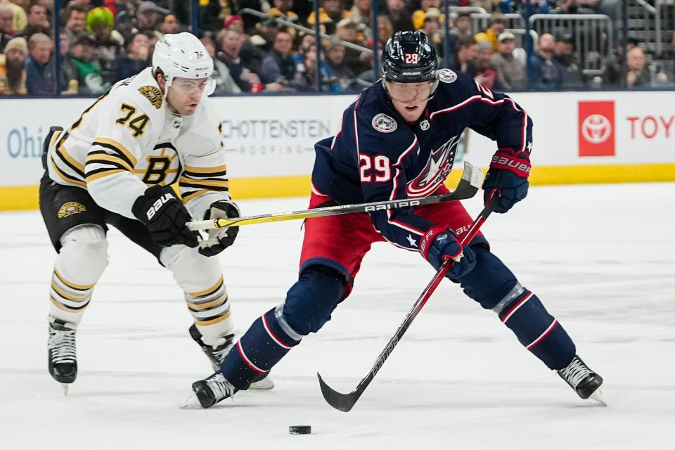 Nov 27, 2023; Columbus, Ohio, USA; Columbus Blue Jackets right wing Patrik Laine (29) skates past Boston Bruins left wing Jake DeBrusk (74) during the first period of the NHL game at Nationwide Arena.