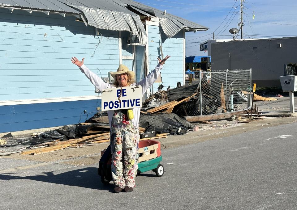 Cheryl Cargile, aka the Wagon Lady, was out spreading positivity in the damaged areas along Thomas Drive on Wednesday.