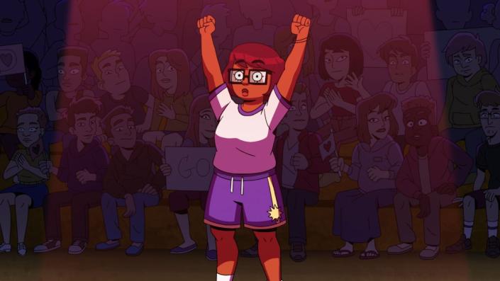  Velma in celebratory stance in gym in Velma 