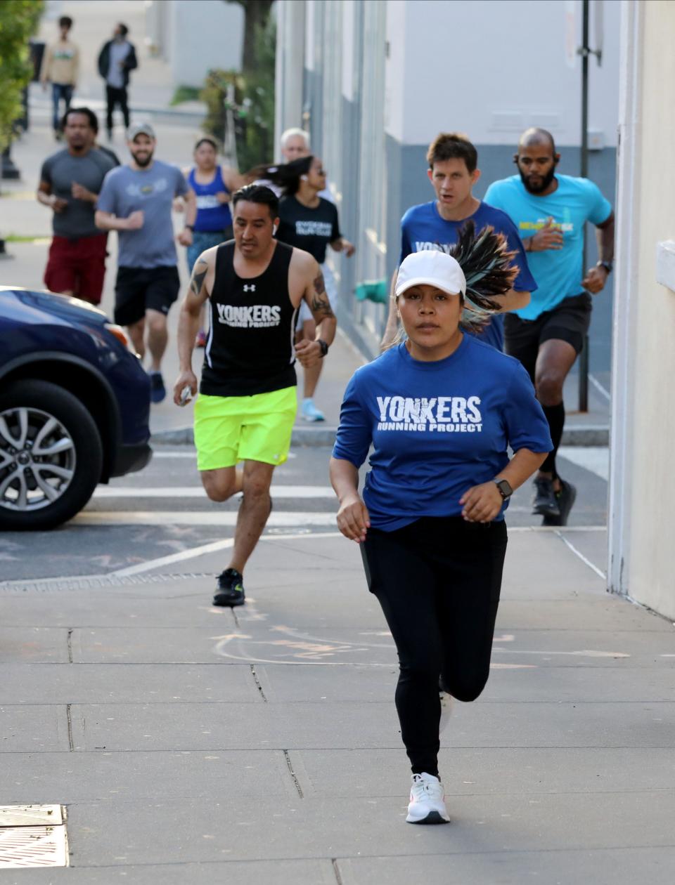 A group from the Yonkers Running Project head up Dock Street in Yonkers, during their weekly run,  May 11, 2022. 