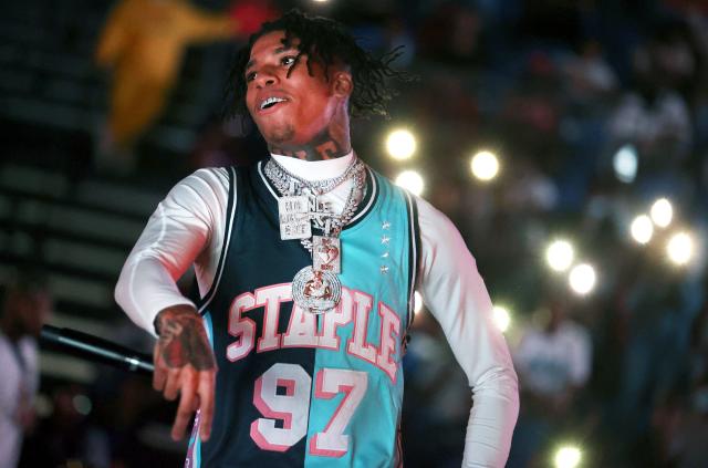 DaBaby attends the game between the Charlotte Hornets and the Los