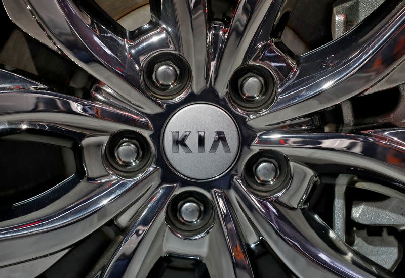 The logo of Kia Motors is seen on a wheel of its Carnival car at the India Auto Expo 2020 in Greater Noida