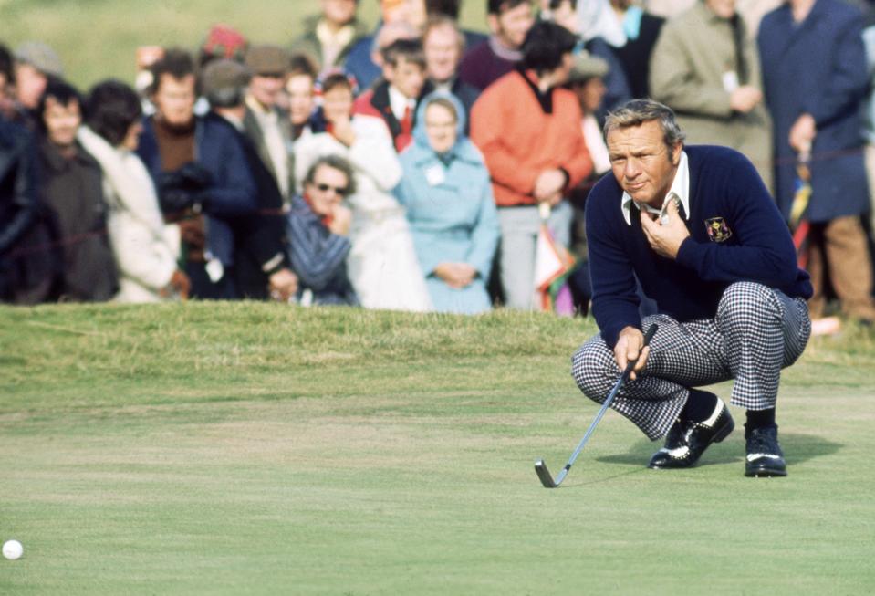 <p>Arnold Palmer of the USA lines up a putt during the Ryder Cup between Europe and the USA at Murifield in Scotland in September, 1973. (photo by Don Morley/Getty Images) </p>