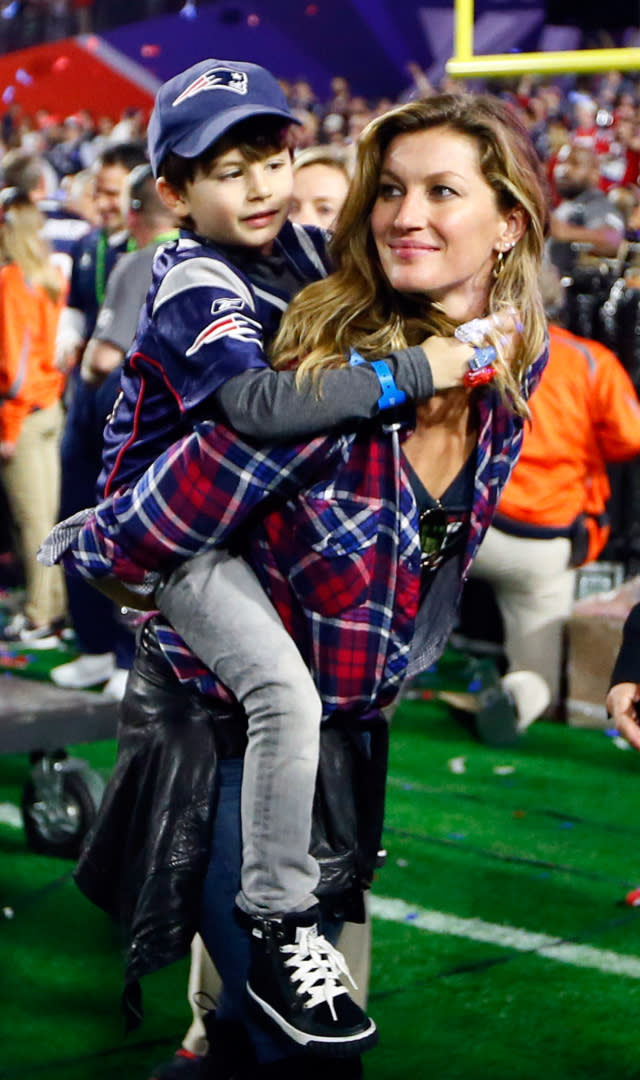 GLENDALE, AZ – FEBRUARY 01: Gisele Bundchen, ex-wife of Tom Brady #12 of the New England Patriots, walks on the field with their son, Benjamin after defeating the Seattle Seahawks during Super Bowl XLIX at University of Phoenix Stadium on February 1, 2015 in Glendale, Arizona. <em>Photo by Kevin C. Cox/Getty Images.</em>