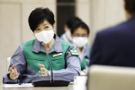 Tokyo Governor Yuriko Koike speaks during a meeting monitoring the new coronavirus situation, at the Metropolitan Government Office Wednesday, July 15, 2020, in Tokyo. Experts on Tokyo’s coronavirus task force have raised caution levels for the infections in the Japanese capital to the highest on a scale of four, and urged officials to step up effort to secure more beds, increase testing capacities and raise awareness among the residents about the urgency. (Kenzaburo Fukuhara/Kyodo News via AP)