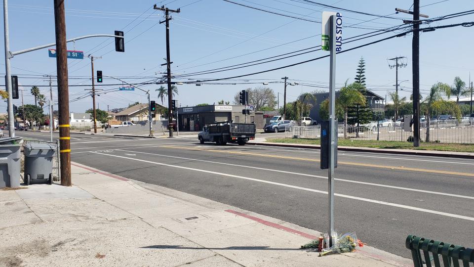 Flowers and candles rest at a bus stop where a 14-year-old Oxnard boy was shot and killed on Sept. 12 in the 1300 block of South C Street.