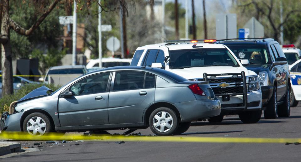 The scene at Indian School Road near 75th Avenue in Phoenix on March 21, 2019, where a Phoenix police officer was struck while investigating a crash. He later died from the injuries.