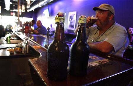 A man enjoys his beer at Tequesta Brewing Co. in Tequesta, Florida April 2, 2014. REUTERS/Javier Galeano