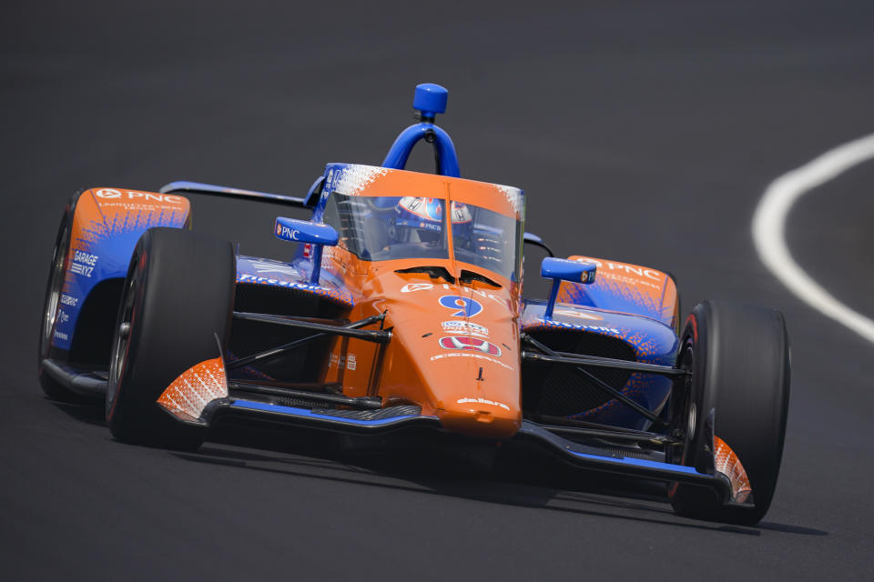 Scott Dixon, of New Zealand, drives through the first turn during qualifications for the Indianapolis 500 auto race at Indianapolis Motor Speedway in Indianapolis, Saturday, May 21, 2022. (AP Photo/Michael Conroy)
