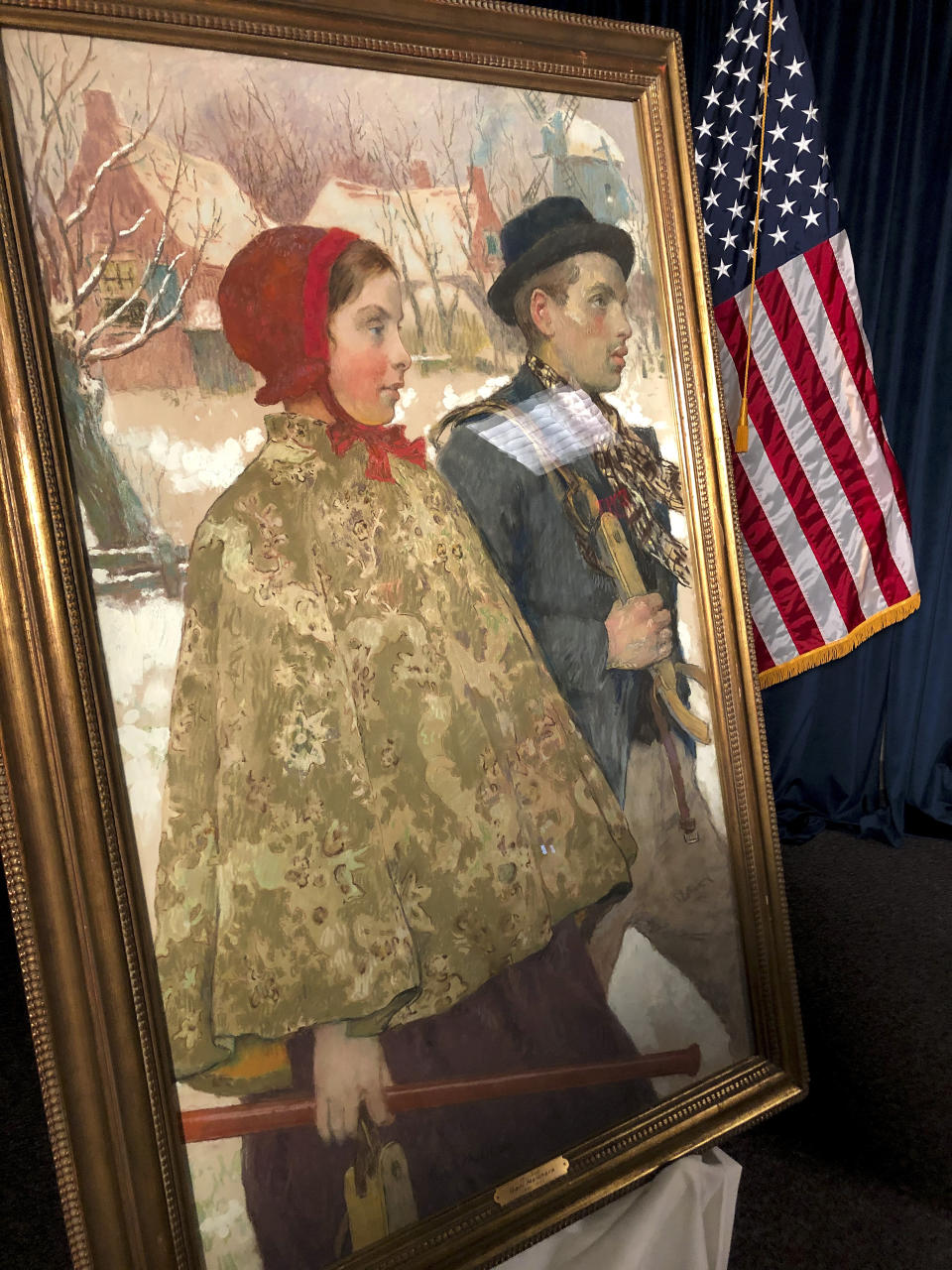 "Winter," a painting by American artist Gari Melchers, sits on display during a repatriation ceremony, Thursday, Oct. 15, 2020, in Albany, N.Y. The painting, discovered in an upstate New York museum, was part of a cache of art seized by the Nazis from the Mosse family in Berlin in 1933. (AP Photo/Michael Hill)