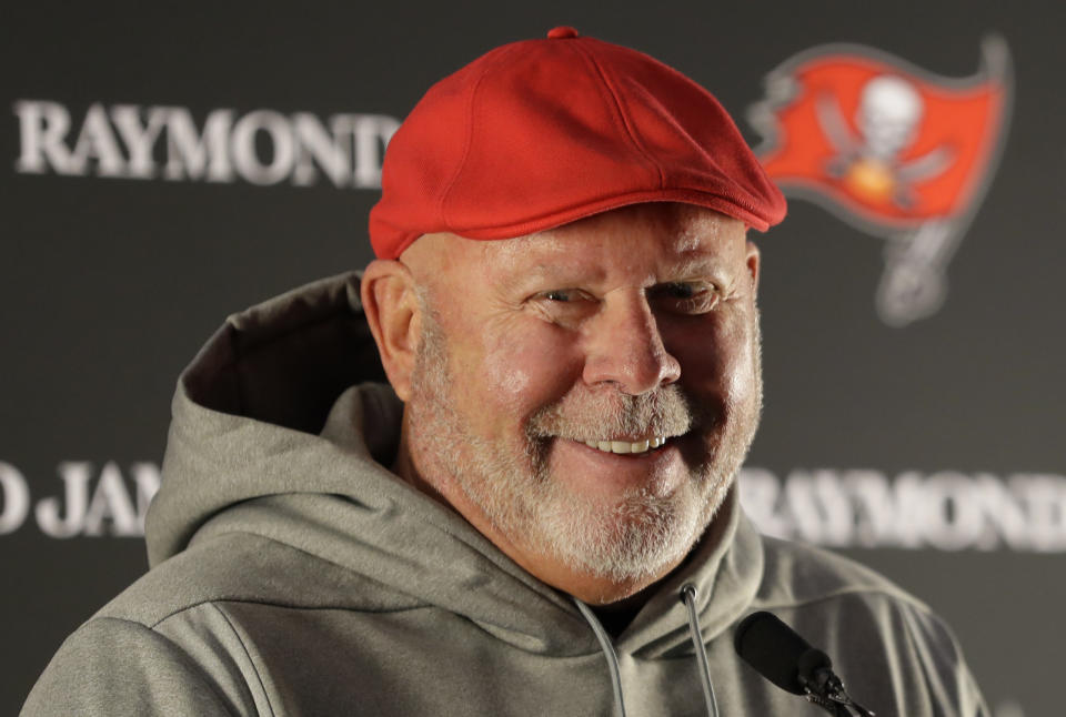 Bruce Arians smiles during a news conference.