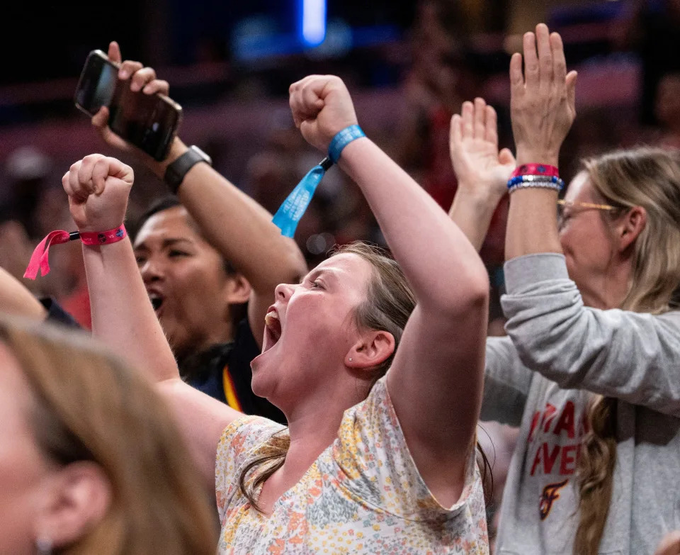 Claire Roberts, 10, cheers after Indiana Fever made a basket Wednesday, June 19, 2024, during the game at Gainbridge Fieldhouse in Indianapolis. The Indiana Fever defeated the Washington Mystics, 88 - 81.