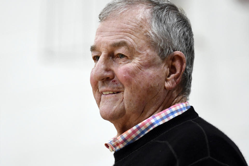 Saint Joseph coach Jim Calhoun smiles during the first half of the team's NCAA college basketball game against Pratt Institute, Friday, Jan. 10, 2020, in West Hartford, Conn. Now coaching Division III basketball with the same fire he stalked the sidelines at UConn, Calhoun is reaching his 900th win as a college coach. (AP Photo/Jessica Hill)