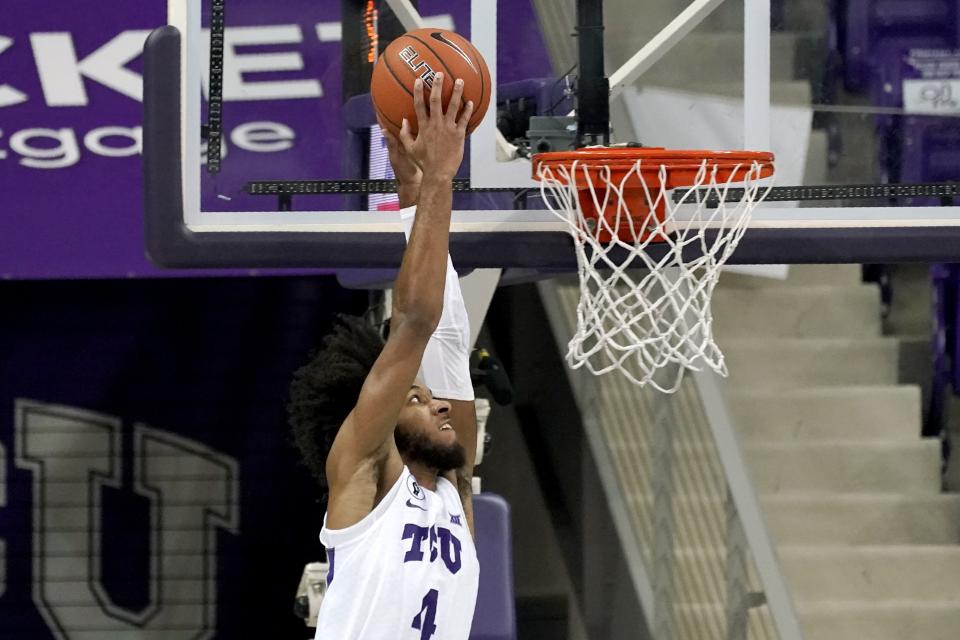 TCU guard PJ Fuller (4) goes up to dunk the ball in the first half of an NCAA college basketball game against North Dakota State in Fort Worth, Texas, Tuesday, Dec. 22, 2020. (AP Photo/Tony Gutierrez)