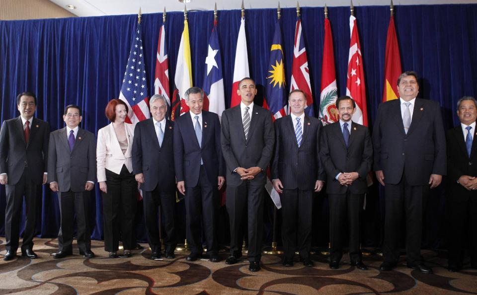 FILE - In this Nov. 14, 2010 file photo, U.S. President Barack Obama, center, takes part in the Trans-Pacific Partnership meeting at the APEC summit in Yokohama, Japan. Several countries expressed hope Tuesday, Jan. 24, 2017, that the TPP could be salvaged, after President Donald Trump's decision on a U.S. withdrawal from the trade pact left its future in serious jeopardy. Pictured left to right: Prime Minister Naoto Kan of Japan, Vietnamese President Nguyen Minh Triet, Prime Minister Julia Gillard of Australia, Chilean President Sebastian Pinera, Prime Minister Lee Hsien Loong of Singapore, President Obama, Prime Minister John Key of New Zealand, Sultan Hassanal Bolkiah of Brunei, President Alan Garcia of Peru, Malaysian Deputy Prime Minister Muhyiddin Yassin. (AP Photo/Charles Dharapak, File)