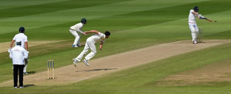 England's Adam Lyth (R) plays a shot off the bowling of Australia's Mitchell Starc (C) on the third day of the third Ashes cricket test match at Edgbaston in Birmingham, central England, on July 31, 2015