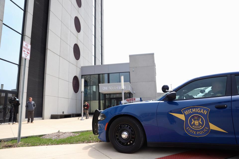 Michigan State Police investigators at Macomb County Administration Building in Mount Clemens on April 17, 2019. Macomb County Prosecutor Eric Smith is under investigation over his office's handling of asset forfeiture funds.