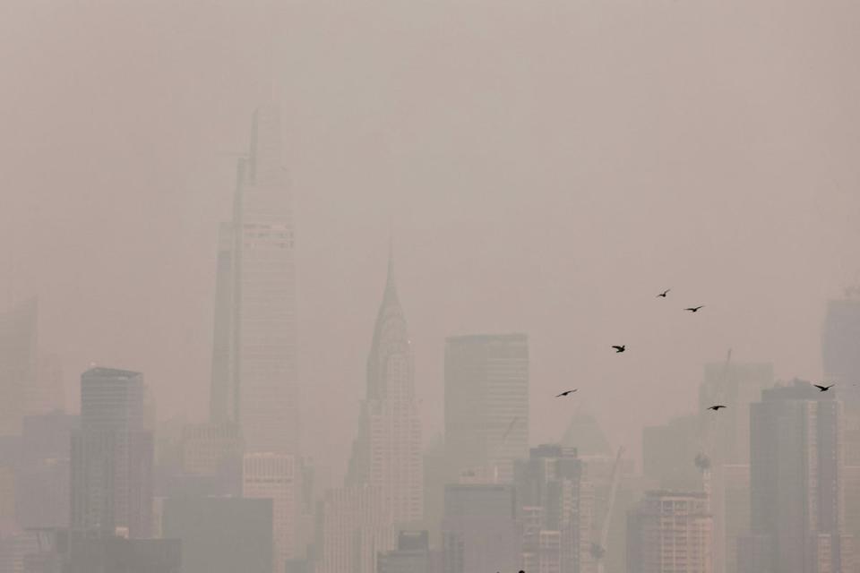 The Manhattan skyline is seen covered in haze and smoke caused by wildfires in Canada on June 7, 2023 (REUTERS)