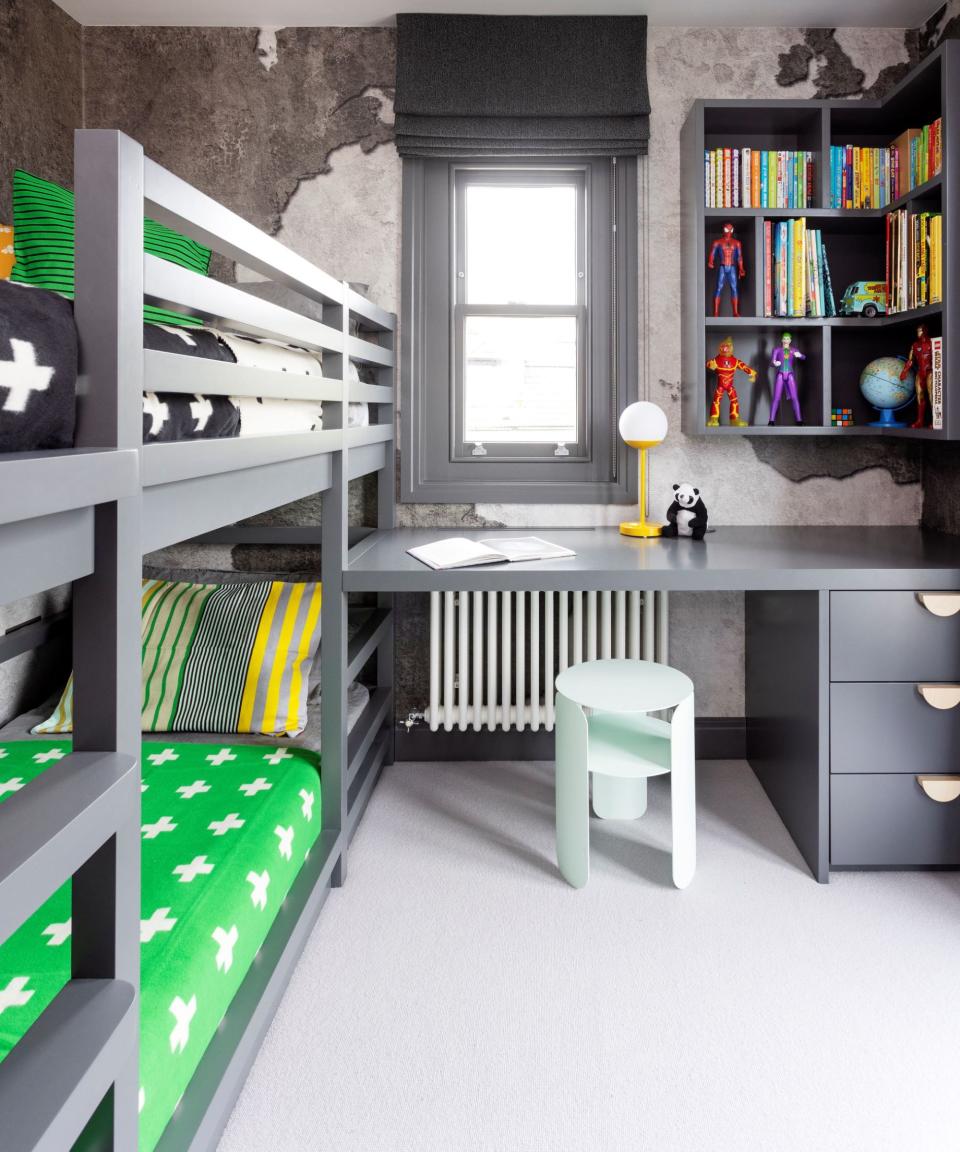 Child's bedroom with gray furniture and green bedding