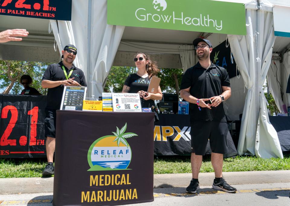 Jason Waters, left, Hannah Weber and Alexander Santana of Releaf Medical at their booth Saturday at SunFest.