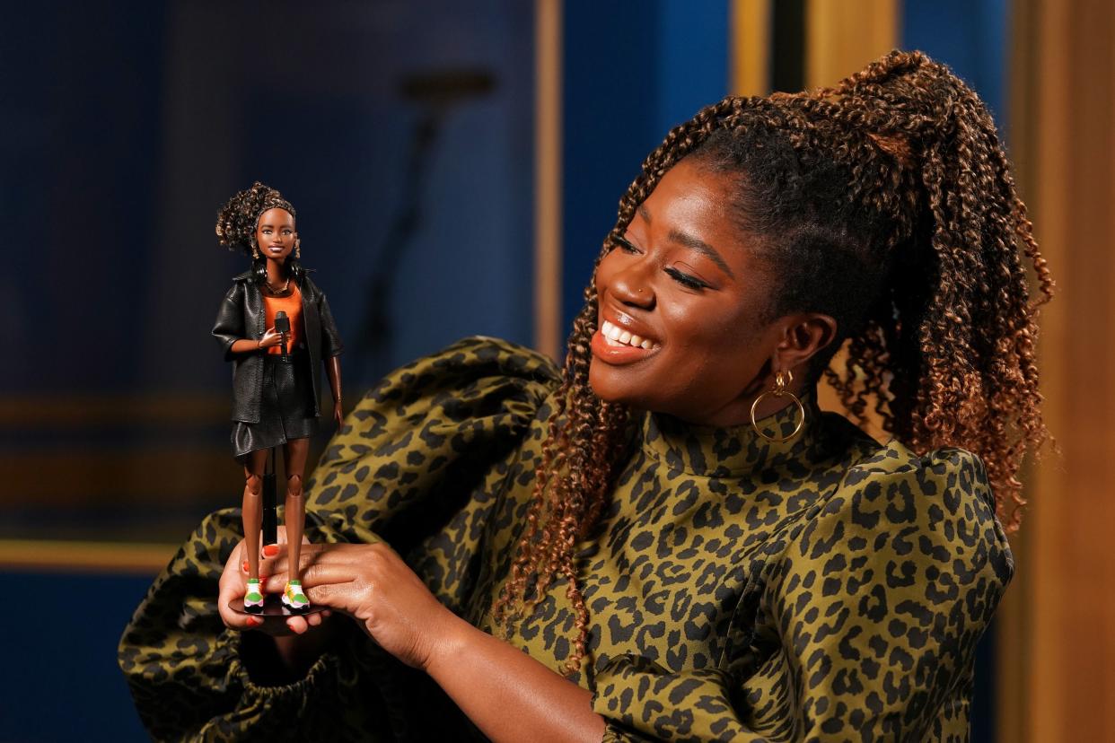 <p>Clara Amfo with her new Barbie doll.</p> (PA)