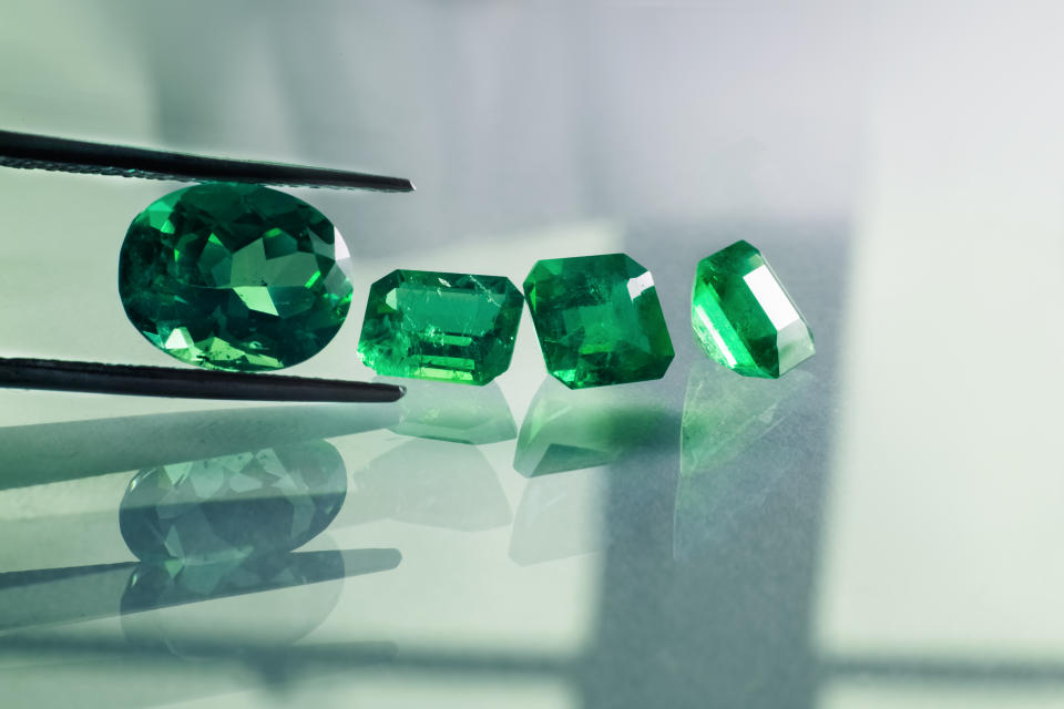 raw stones and emeralds cut