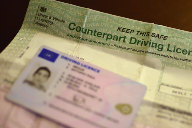 A UK driving licence shown beside a counterpart driving licence, London.