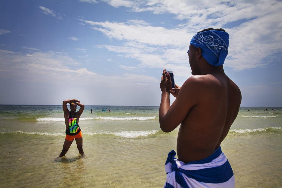 Kentrell poses for a photo on a trip to the beach with teammate Jerel. The two have emerged as leaders and role models in the group. Kentrell, as team captain, holds a great deal of authority, but Jerel, who the group also refers to as "the mom," often provides the kind of guidance that can often be identified as parental in nature. The Prancing Elites are a group of young, gay, black men who practice J-Sette, a form of dance birthed at Historically Black Colleges that is characterized by sharp, cheerleading-style movements and hip-hop performed to an eight-count beat. Traditionally, men cannot join college dance teams, so young gay black men have been forming their own J-Sette "lines," organizing competitions, and creating their own outlets to practice this type of dance.