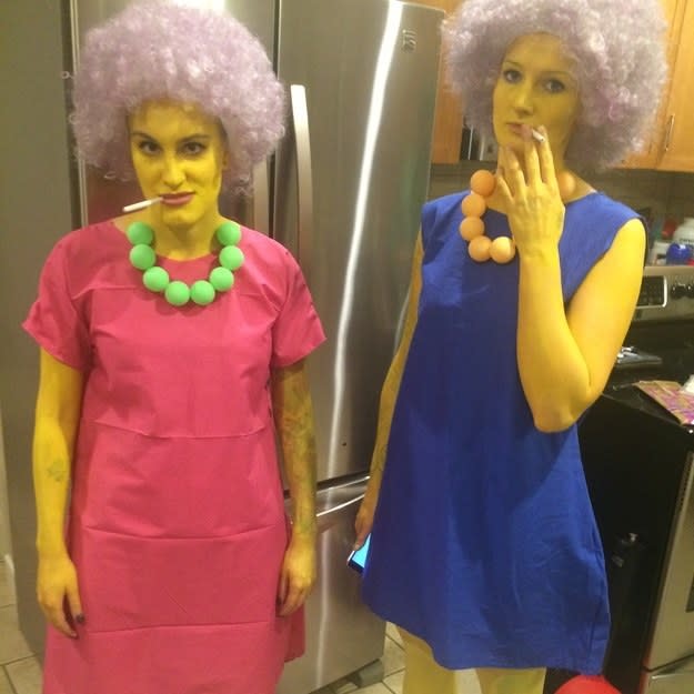 Two people dressed as Aunt Selma and Patty from "The Simpsons"