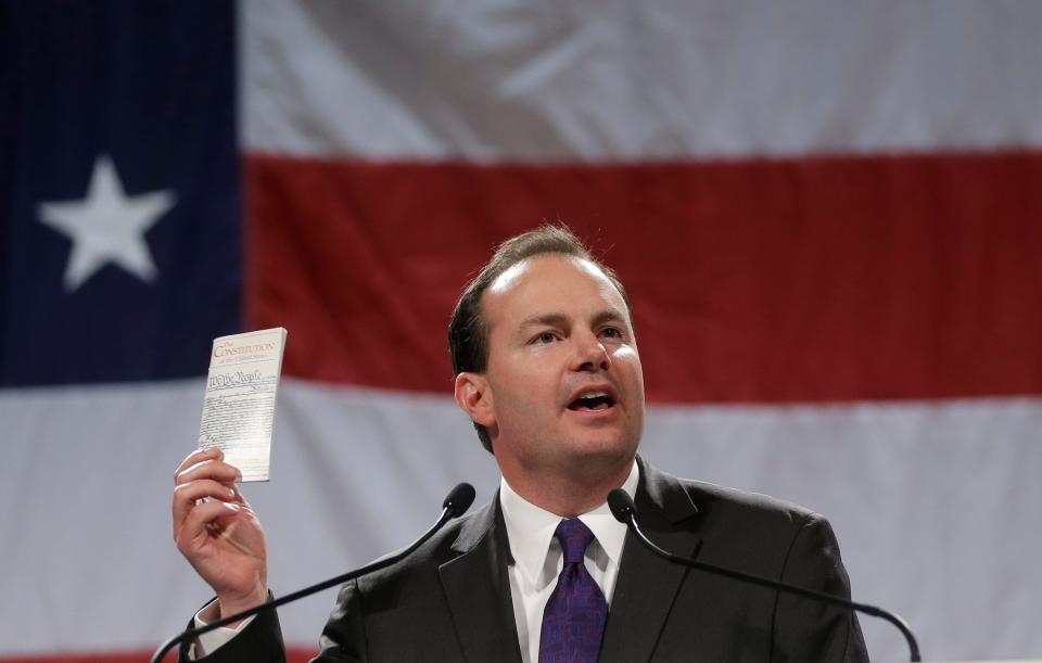 FILE - Sen. Mike Lee, R-Utah, addresses a crowd during a rally on April 25, 2014, in Sandy, Utah. Lee, after sailing to victory in past elections, is being pushed by independent Evan McMullin toward uncharted waters, into a race that will test how Trump loyalists fare with voters when offered choices beyond the two-party system.