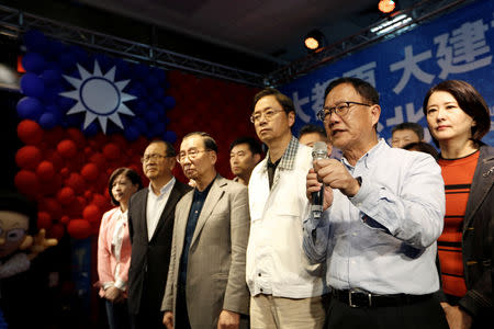 Taiwan's opposition Nationalist Kuomintang Party (KMT) Taipei mayoral candidate Ting Shou-chung announces he will file a suit regarding the election result in Taipei, Taiwan November 25, 2018. REUTERS/Ann Wang