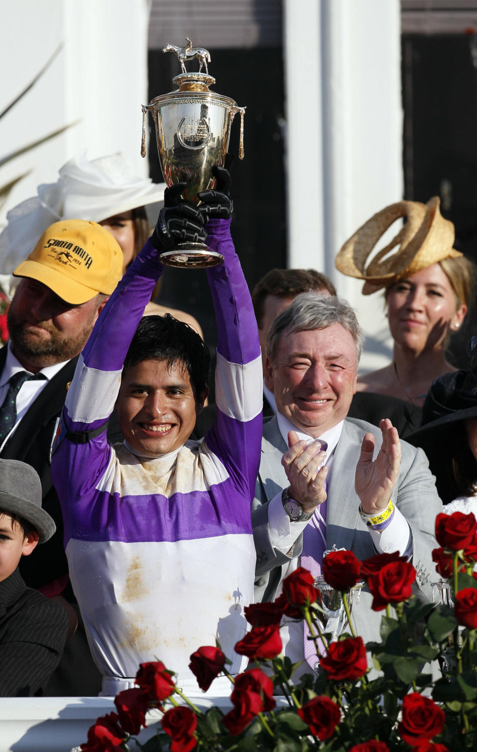 Jockey Mario Gutierrez reacts with owner J. Paul Reddam after riding I'll Have Another to victory in the 138th Kentucky Derby horse race at Churchill Downs Saturday, May 5, 2012, in Louisville, Ky. (AP Photo/Mark Humphrey)