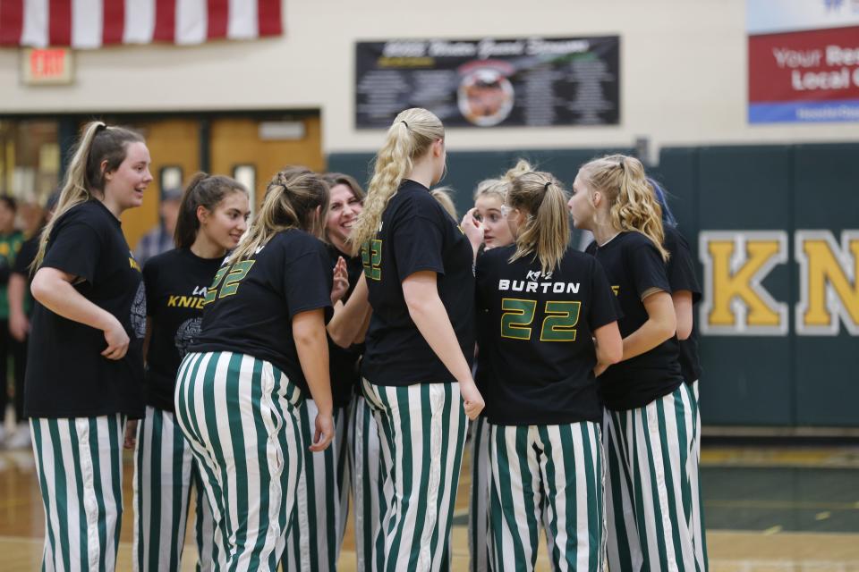 The Northeastern Knights get ready for a game against Centerville following a ceremony honoring Seara Burton Dec. 2, 2022.